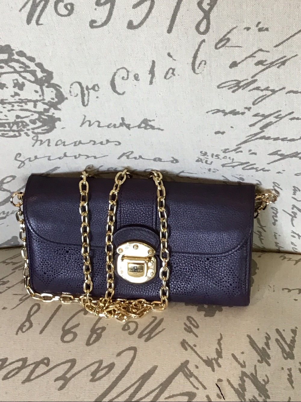 Louis Vuitton Rare Dark Purple Leather Wallet, gold hardware, pockets leather.